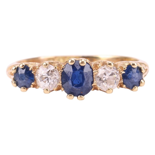 194 - An Edwardian sapphire and diamond half-hoop ring in 18ct gold, comprising three graduated circular-c... 