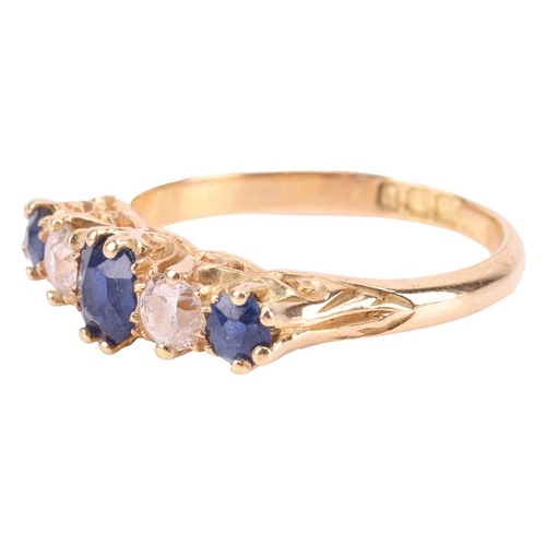 194 - An Edwardian sapphire and diamond half-hoop ring in 18ct gold, comprising three graduated circular-c... 