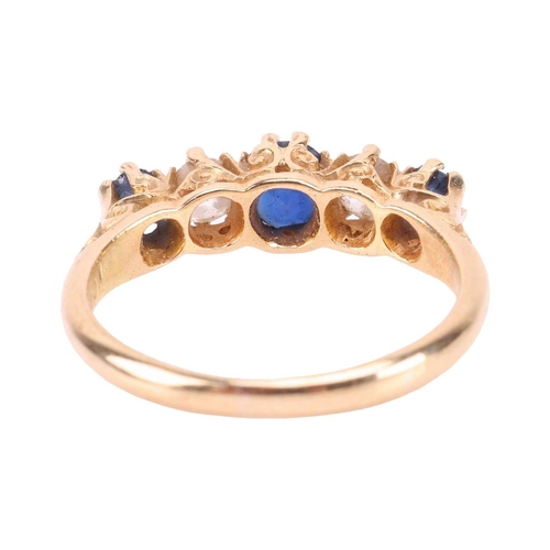 194 - An Edwardian sapphire and diamond half-hoop ring in 18ct gold, comprising three graduated circular-c... 