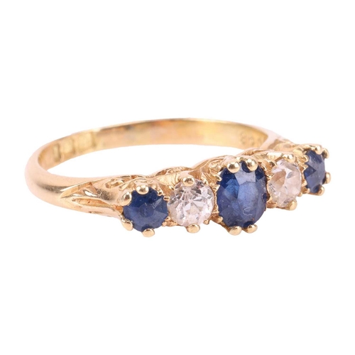 194 - An Edwardian sapphire and diamond half-hoop ring in 18ct gold, comprising three graduated circular-c... 