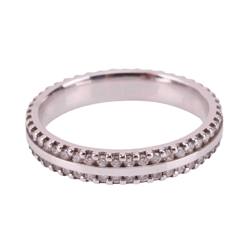 198 - A diamond-set wedding band in platinum, flat polished band edged with two rows of diamond accents, B... 