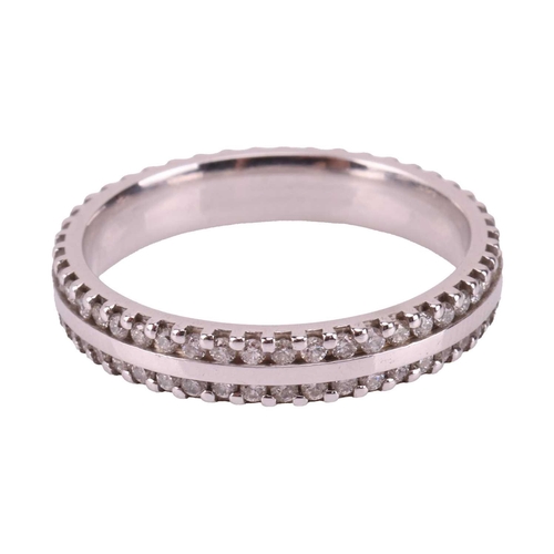 198 - A diamond-set wedding band in platinum, flat polished band edged with two rows of diamond accents, B... 