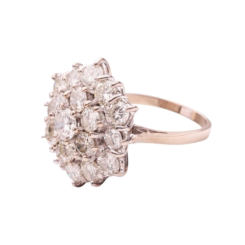 200 - A diamond-set floral cluster ring, featuring nineteen round brilliant diamonds, with an estimated to... 