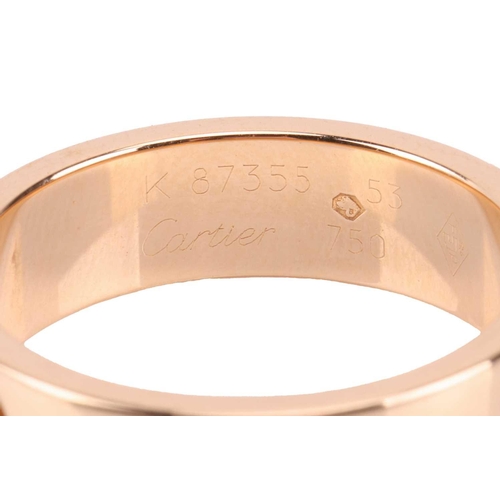 202 - Cartier - a 'Love' ring, flat polished band decorated with screw-head motifs, signed and numbered, s... 