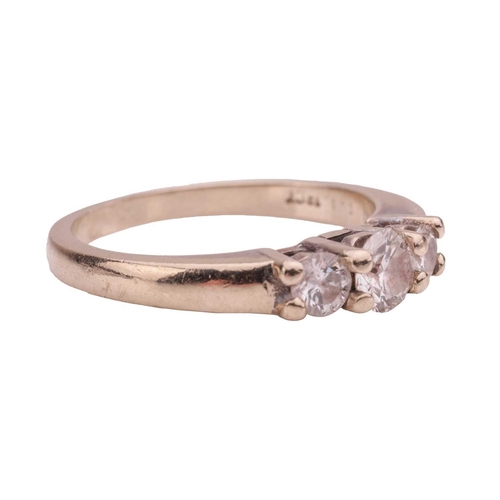 216 - A diamond trilogy ring, comprising three graduated round brilliant-cut diamonds, with an estimated t... 