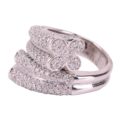 226 - A diamond-set cocktail ring of crossover design, terminated with quatrefoil motifs, encrusted with b... 