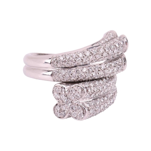 226 - A diamond-set cocktail ring of crossover design, terminated with quatrefoil motifs, encrusted with b... 