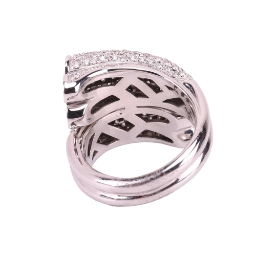 226 - A diamond-set cocktail ring of crossover design, terminated with quatrefoil motifs, encrusted with b... 