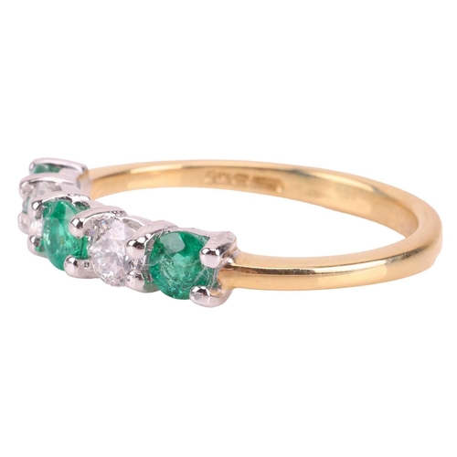 235 - An emerald and diamond-set half-hoop ring, featuring five alternating round-cut emeralds and diamond... 