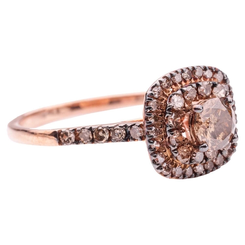 237 - A brown diamond cluster ring in 9ct rose gold, centred with a round brilliant-cut diamond in claw se... 