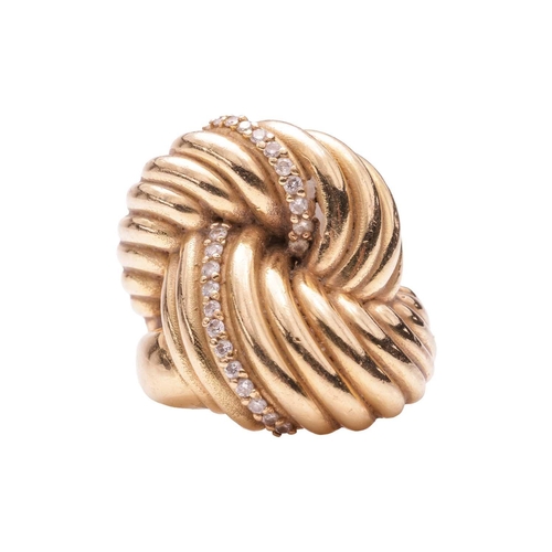 249 - A diamond-set knot ring, of ribbed design, highlighted with a row of diamond embellishment estimated... 