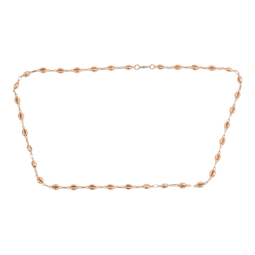 250 - A coffee bean link necklace, comprising a series of coffee bean links alternating with a textured an... 