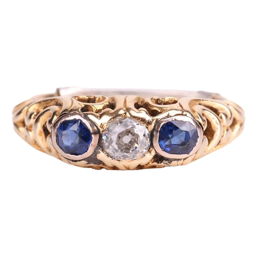 252 - A diamond and sapphire half hoop ring, centred with an old-cut diamond with an estimated weight of 0... 