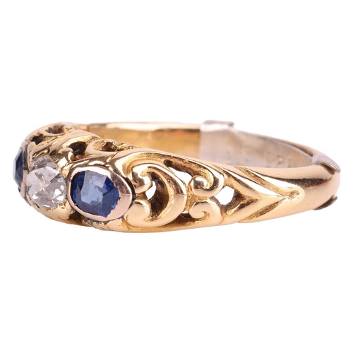 252 - A diamond and sapphire half hoop ring, centred with an old-cut diamond with an estimated weight of 0... 