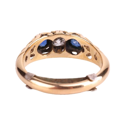 252 - A diamond and sapphire half hoop ring, centred with an old-cut diamond with an estimated weight of 0... 