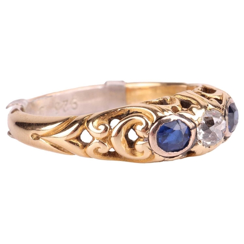 252 - A diamond and sapphire half hoop ring, centred with an old-cut diamond with an estimated weight of 0... 