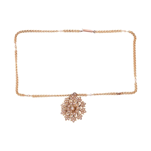 253 - A flowerhead pendant on chain, the tiered floral mount with petals encrusted with split pearls, supe... 