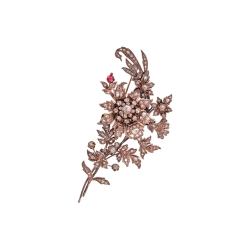 257 - A late Ottoman floral spray brooch, composed of raised flowerhead clusters and foliate motifs, set t... 