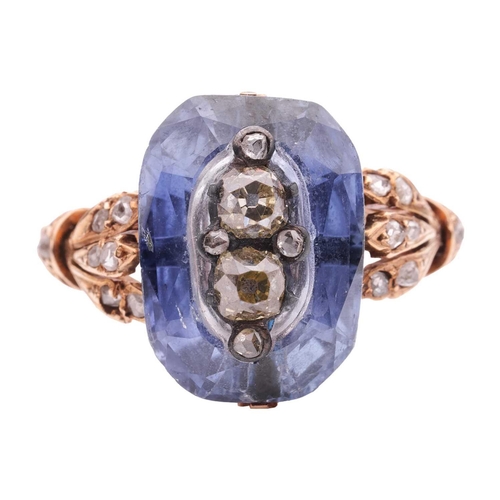 260 - A sapphire and diamond dress ring, featuring a centrally carved cushion-cut sapphire of 13.6 x 9.5 m... 