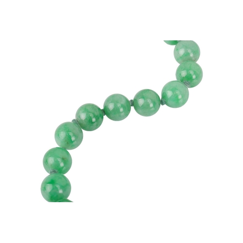 262 - A jade bead necklace with emerald and diamond clasp, circa 1920s, comprising a single row of 108 uni... 