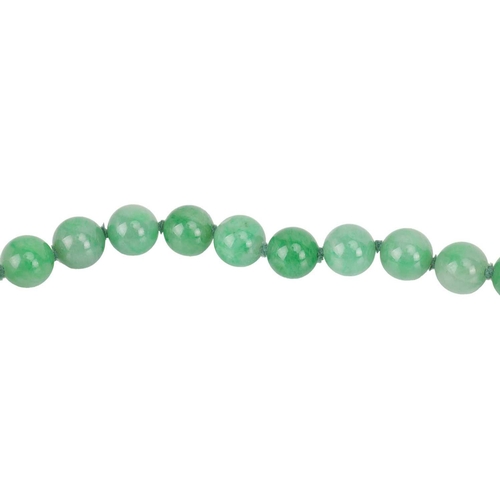 262 - A jade bead necklace with emerald and diamond clasp, circa 1920s, comprising a single row of 108 uni... 