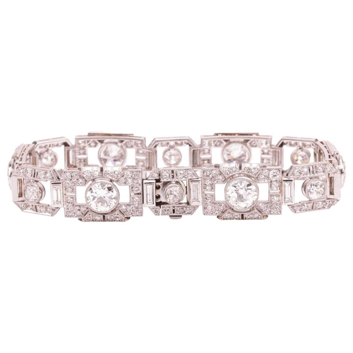 267 - An Art Deco diamond link bracelet, angular links alternating with old-cut diamonds and flanked by ba... 