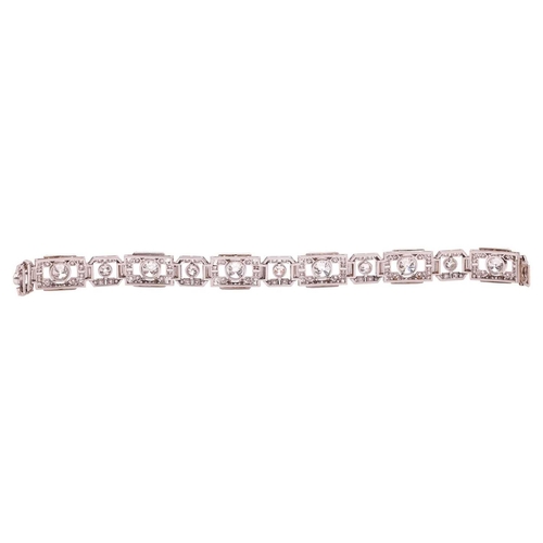 267 - An Art Deco diamond link bracelet, angular links alternating with old-cut diamonds and flanked by ba... 