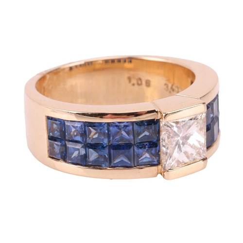 269 - Moussaieff - a diamond and sapphire dress ring, centred with a princess-cut diamond in a raised moun... 