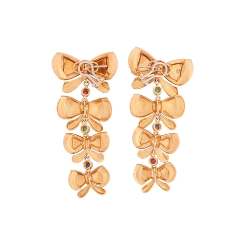 32 - A pair of bow drop earrings, each comprising four graduated and stylised bows, tiered with links in ... 