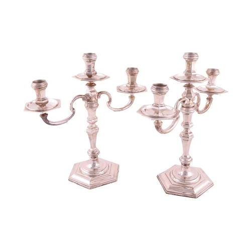 352 - A pair of early 18th century style three light candelabra; panelled hexagonal form with detachable s... 