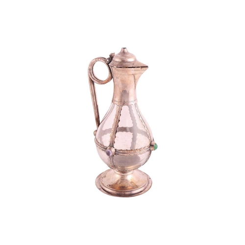 354 - A Victorian silver mounted, gem-set communion wine jug; the plain bulbous glass body overlaid with a... 