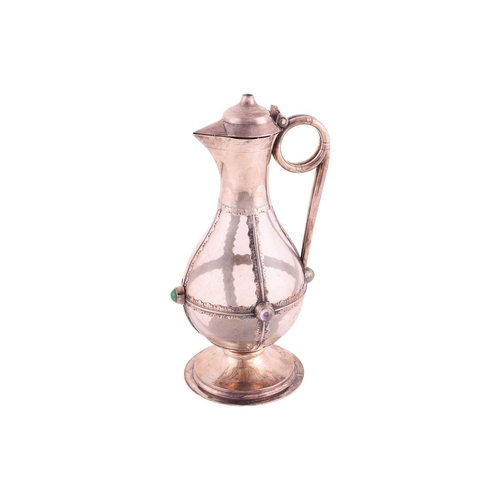 354 - A Victorian silver mounted, gem-set communion wine jug; the plain bulbous glass body overlaid with a... 