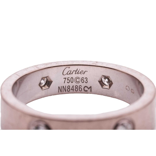 38 - Cartier - an 18ct white gold 'Love' ring set with six diamonds, the polished flat band flush-set wit... 