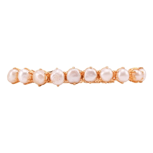 39A - A pearl-set line bracelet, comprising a row of eleven off-rounded button pearls in hinged mounts, at... 