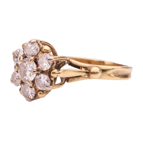 53 - A diamond-set floral cluster ring, with seven round brilliant diamonds, the central diamond measurin... 