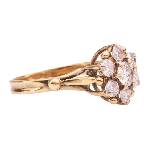 53 - A diamond-set floral cluster ring, with seven round brilliant diamonds, the central diamond measurin... 