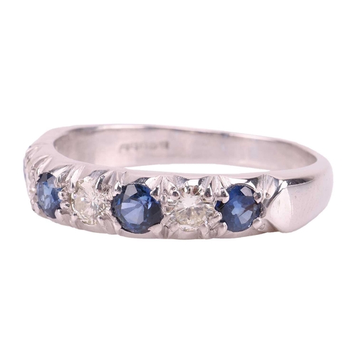 54 - A sapphire and diamond half-eternity ring in 18ct white gold, comprising four circular-cut sapphires... 