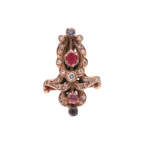 60 - A diamond, ruby and sapphire dress ring, of scrolled design, encrusted with single-cut diamonds, and... 