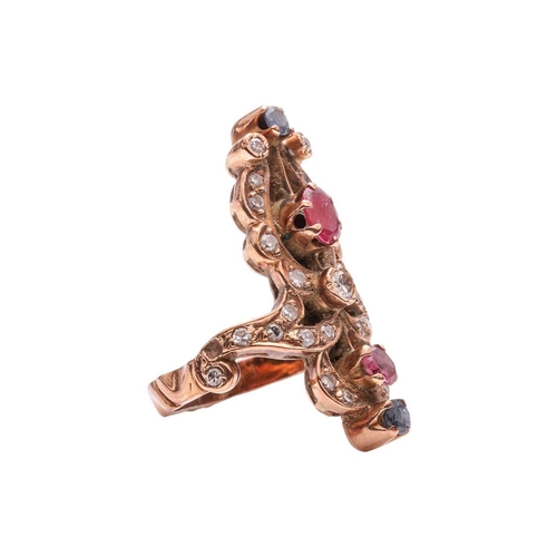 60 - A diamond, ruby and sapphire dress ring, of scrolled design, encrusted with single-cut diamonds, and... 