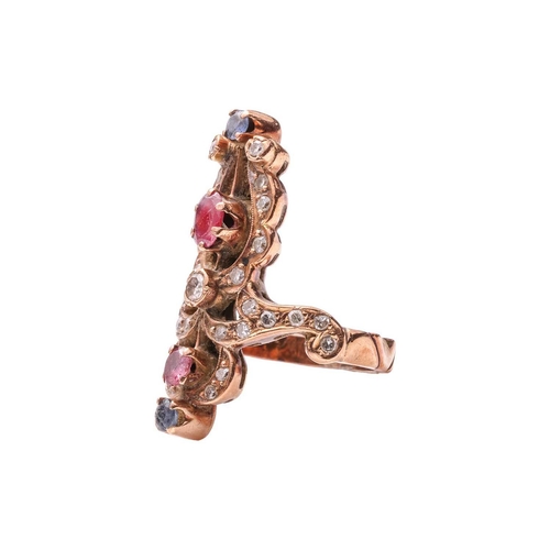 60 - A diamond, ruby and sapphire dress ring, of scrolled design, encrusted with single-cut diamonds, and... 