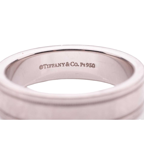 7 - Tiffany & Co. - a wedding band, the flat polished band adorned with corrugated borders, signed and m... 