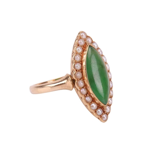 70 - An Edwardian jade and seed pearl cluster ring in 18ct gold, collet-set with a navette-shaped jadeite... 