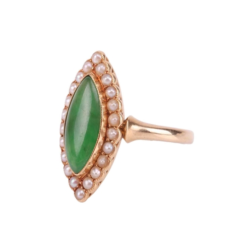 70 - An Edwardian jade and seed pearl cluster ring in 18ct gold, collet-set with a navette-shaped jadeite... 