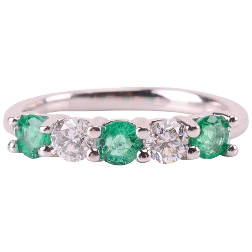 72 - An emerald and diamond five-stone ring, comprising two round brilliant diamonds set between three ro... 