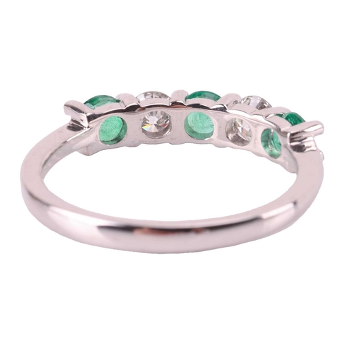 72 - An emerald and diamond five-stone ring, comprising two round brilliant diamonds set between three ro... 