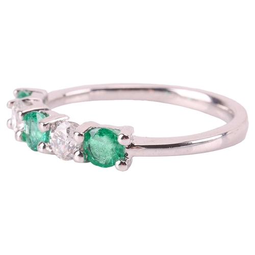 72 - An emerald and diamond five-stone ring, comprising two round brilliant diamonds set between three ro... 