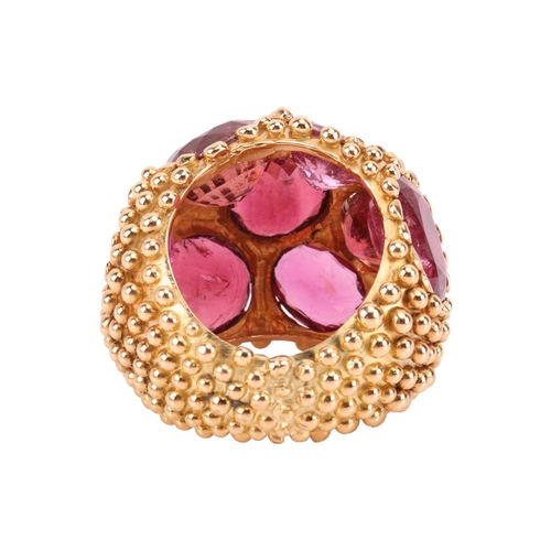 81 - A tourmaline cluster bombé ring/scarf ring of granulated design, composed of nine large oval-cut tou... 