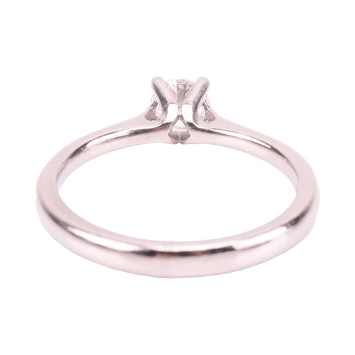 87 - A diamond solitaire ring, featuring a round brilliant diamond measuring approximately 4.8mm with an ... 