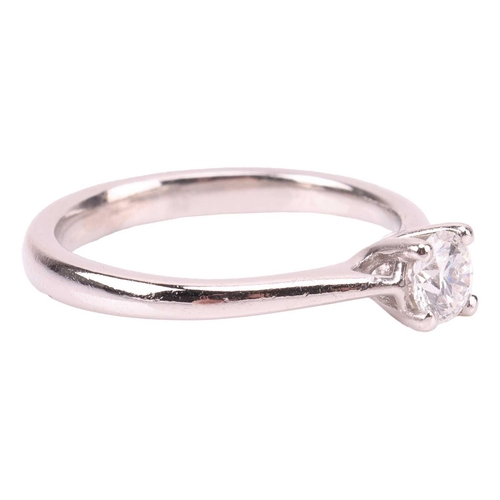 87 - A diamond solitaire ring, featuring a round brilliant diamond measuring approximately 4.8mm with an ... 