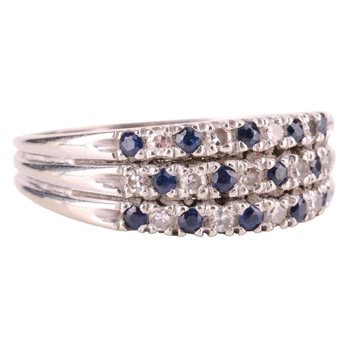 97 - A three-row sapphire and diamond ring, alternating with circular-cut sapphires and single-cut diamon... 